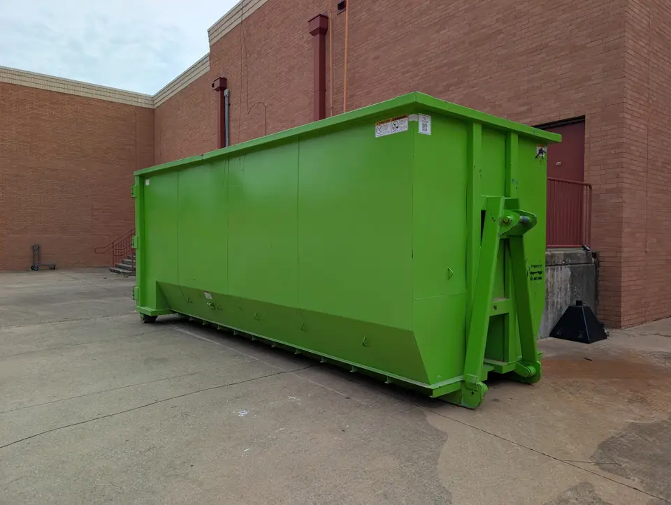 Large roll-off dumpster at a commercial building